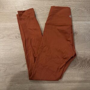Rust colored Lululemon leggings, size 4